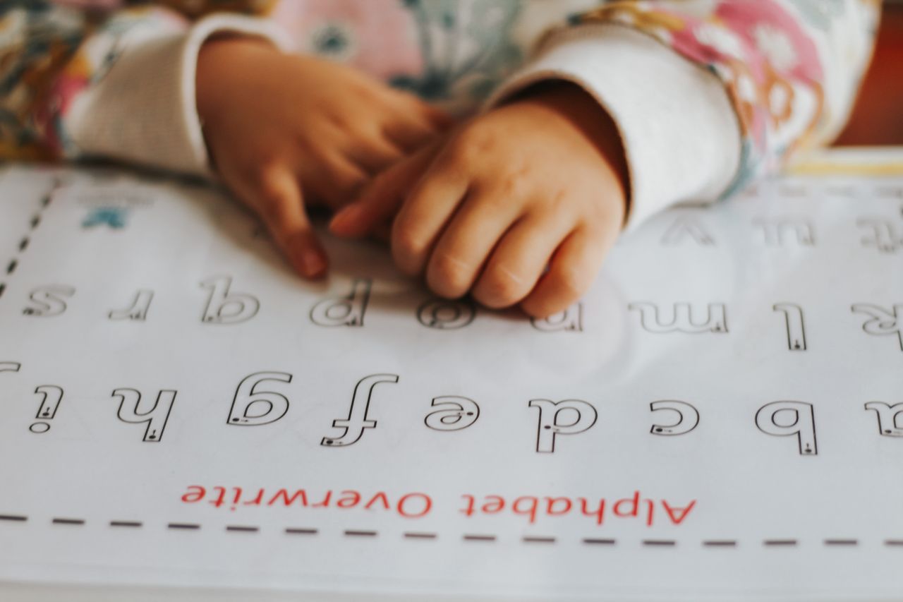 Alphabet overwrite activity in a wipe-clean sleeve