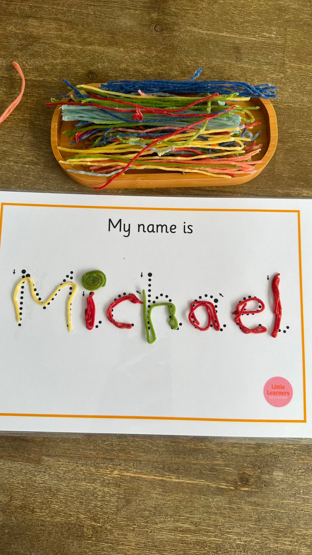 Michael name tracing activity with wax yarn letters